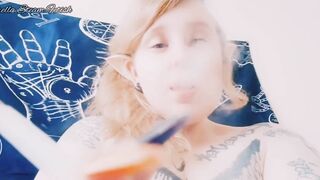 Elf smokes with her tits out