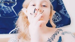 Elf smokes with her tits out