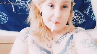 Elf smokes with her tits out