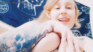 Elf smokes with her tits out