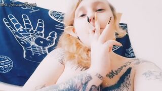 Elf smokes with her tits out