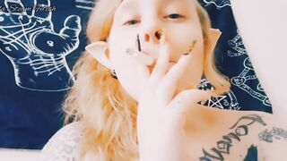 Elf smokes with her tits out