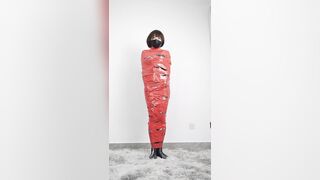 NANA Mummified with red plastic tape and then played with for orgasms