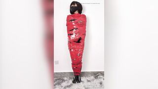NANA Mummified with red plastic tape and then played with for orgasms