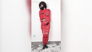 NANA Mummified with red plastic tape and then played with for orgasms