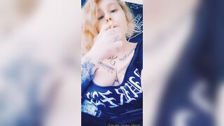 Metal girl smokes a cigarette