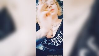 Metal girl smokes a cigarette