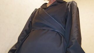 A scene from the rest room where a mature woman takes off her pantyhose and pees.