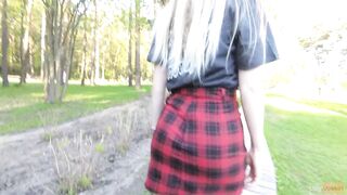 Naughty girl in miniskirt no panties flashing in the park (public upskirt)